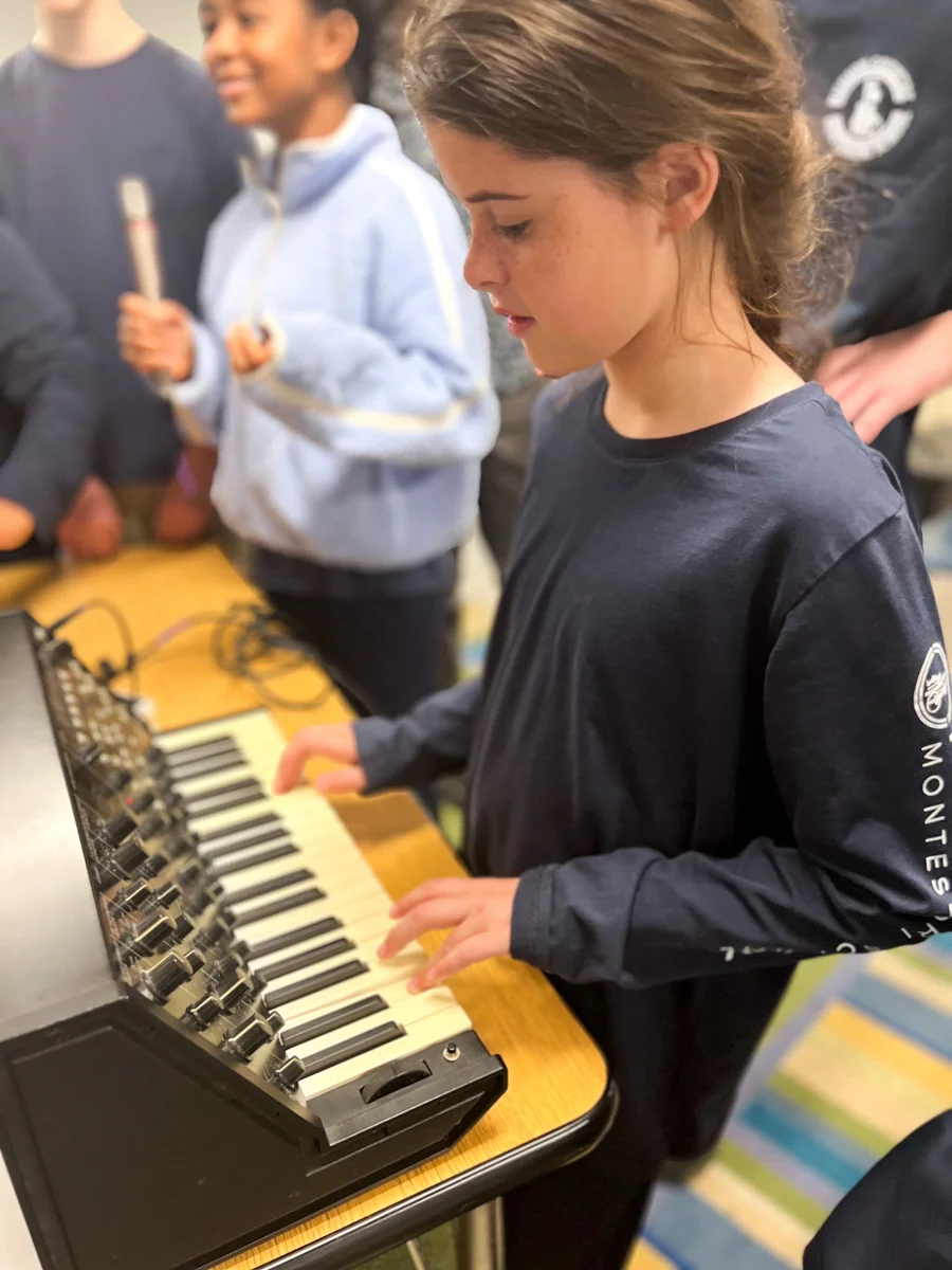 an elementary school student playing music at her private school in tuckahoe